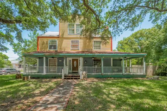 front view of a house with a garden