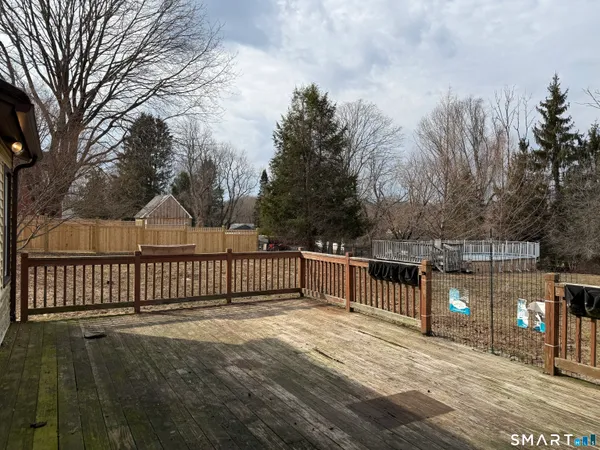 a terrace with trees in the background