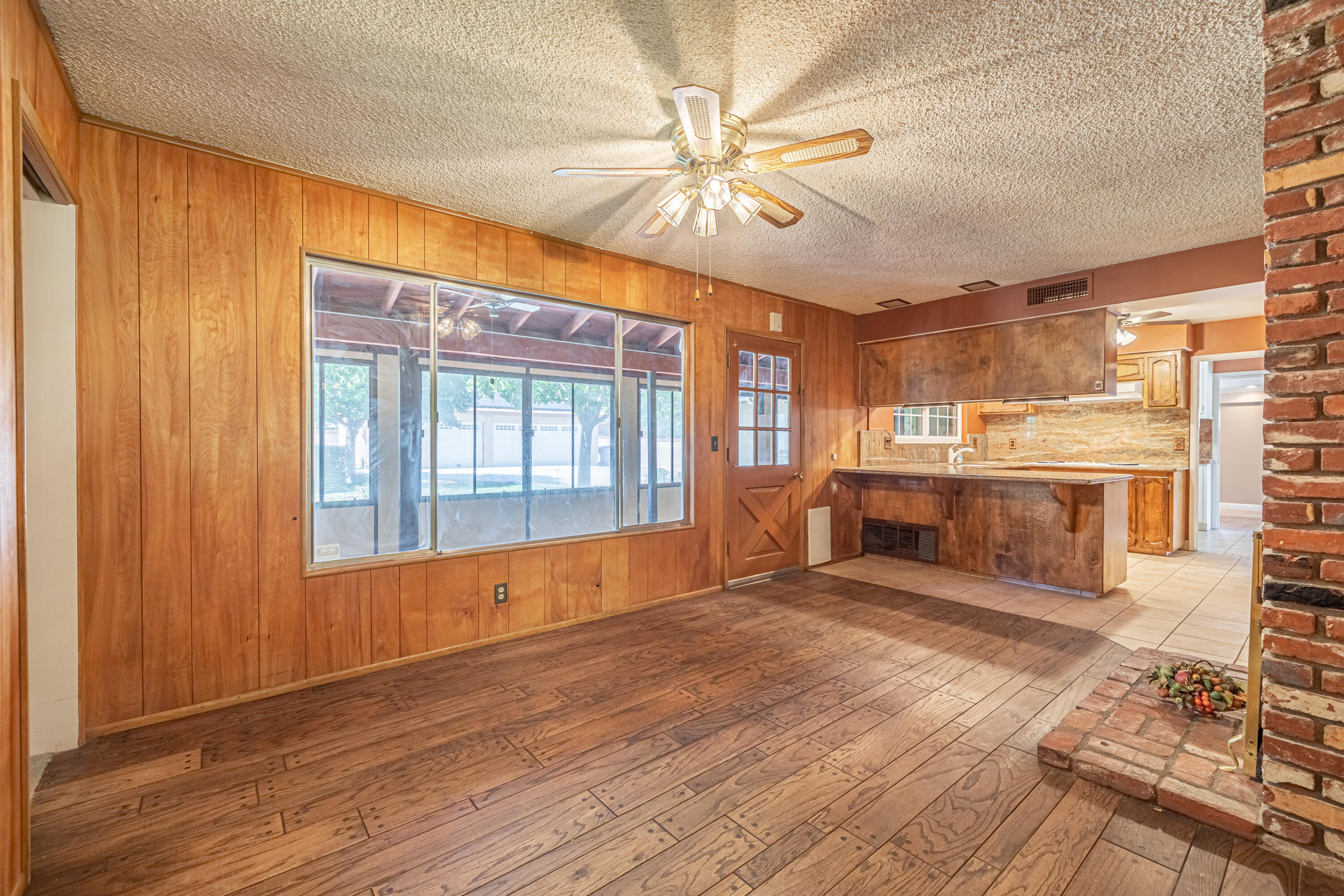 43733 Fenner Avenue Lancaster, CA 93536 - Photo 19 of 48 a view of an empty room with window and wooden floor
