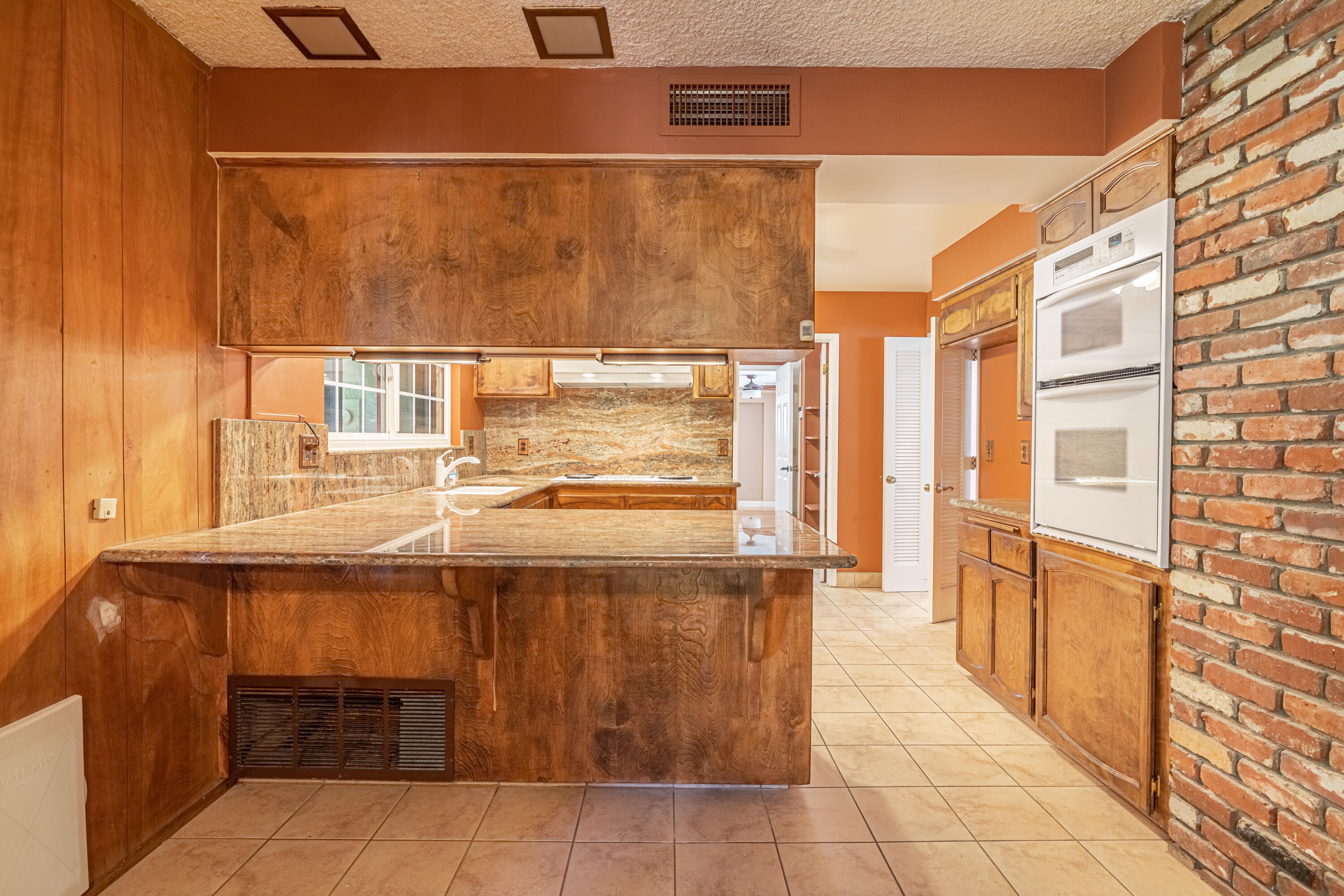 43733 Fenner Avenue Lancaster, CA 93536 - Photo 20 of 48 a kitchen with a sink and cabinets