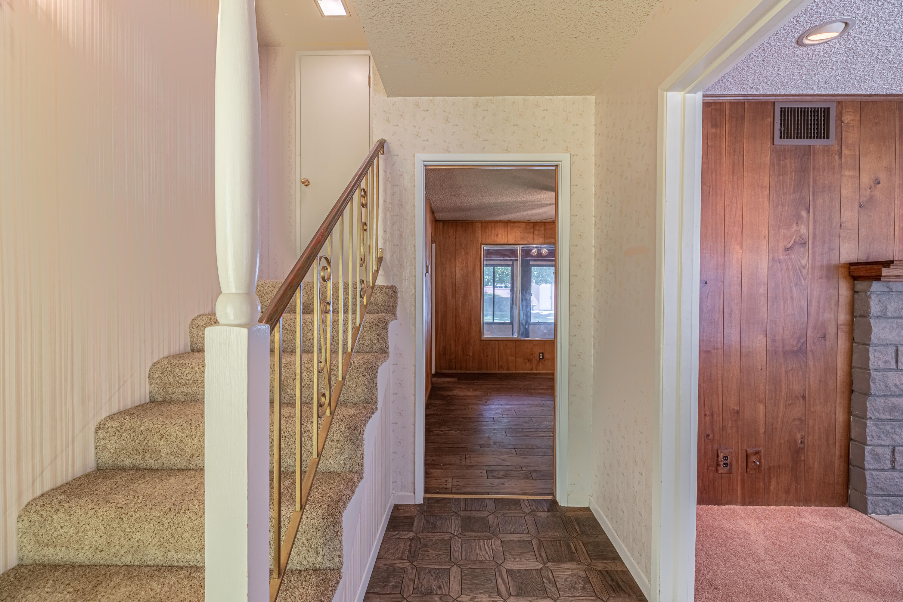 43733 Fenner Avenue Lancaster, CA 93536 - Photo 24 of 48 a view of a hallway with wooden floor and entryway