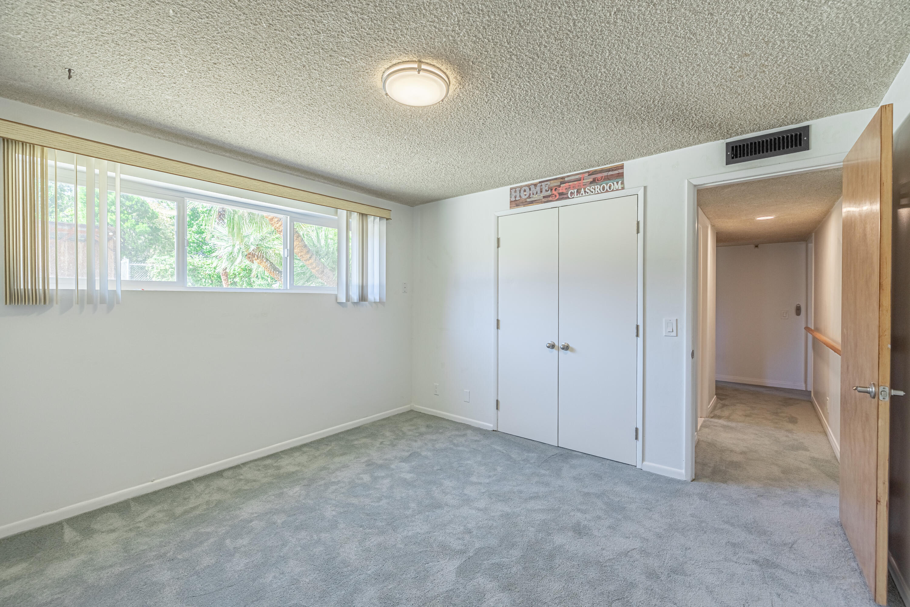 43733 Fenner Avenue Lancaster, CA 93536 - Photo 28 of 48 an empty room with windows and closet