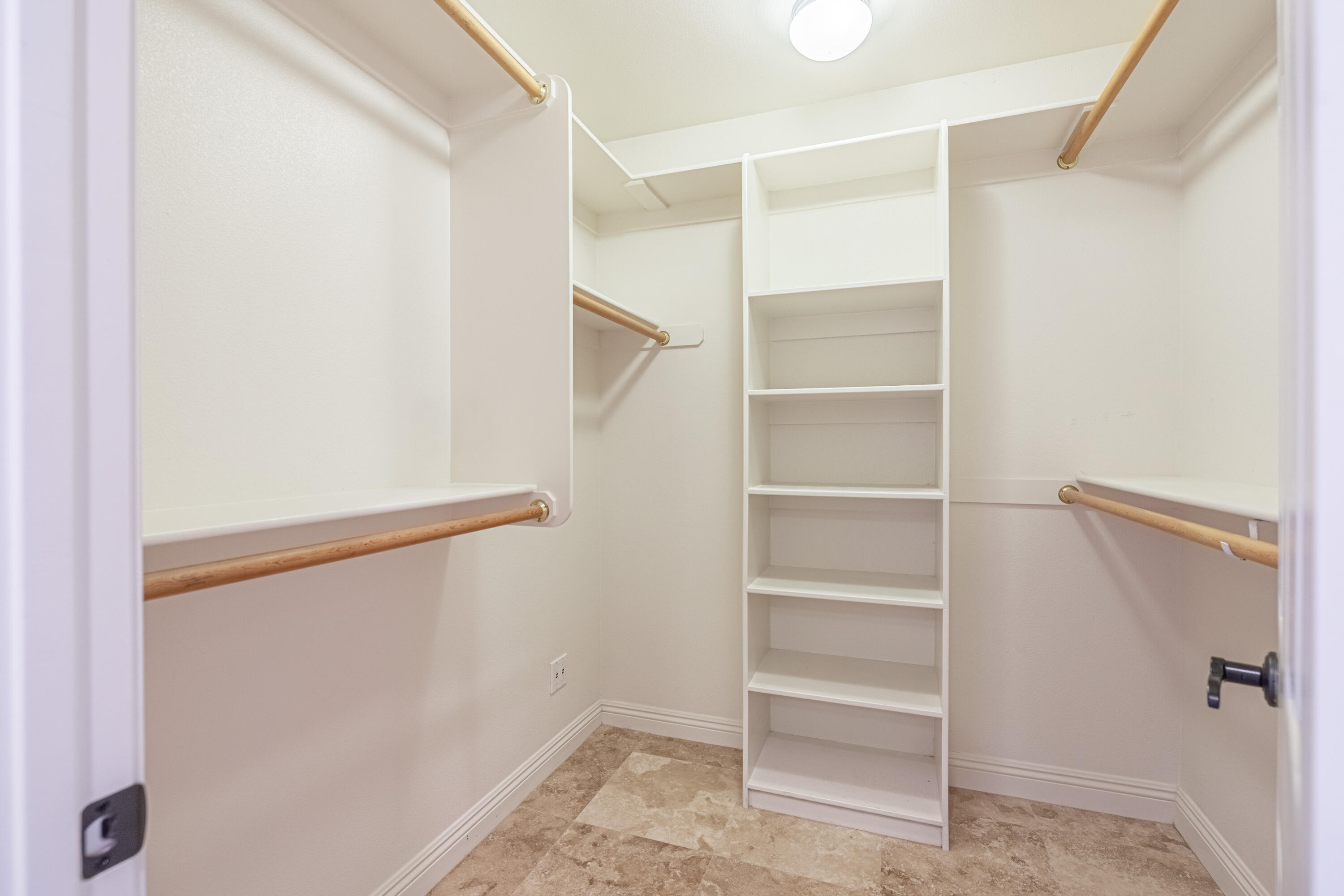 43733 Fenner Avenue Lancaster, CA 93536 - Photo 39 of 48 a view of walk in closet with empty racks