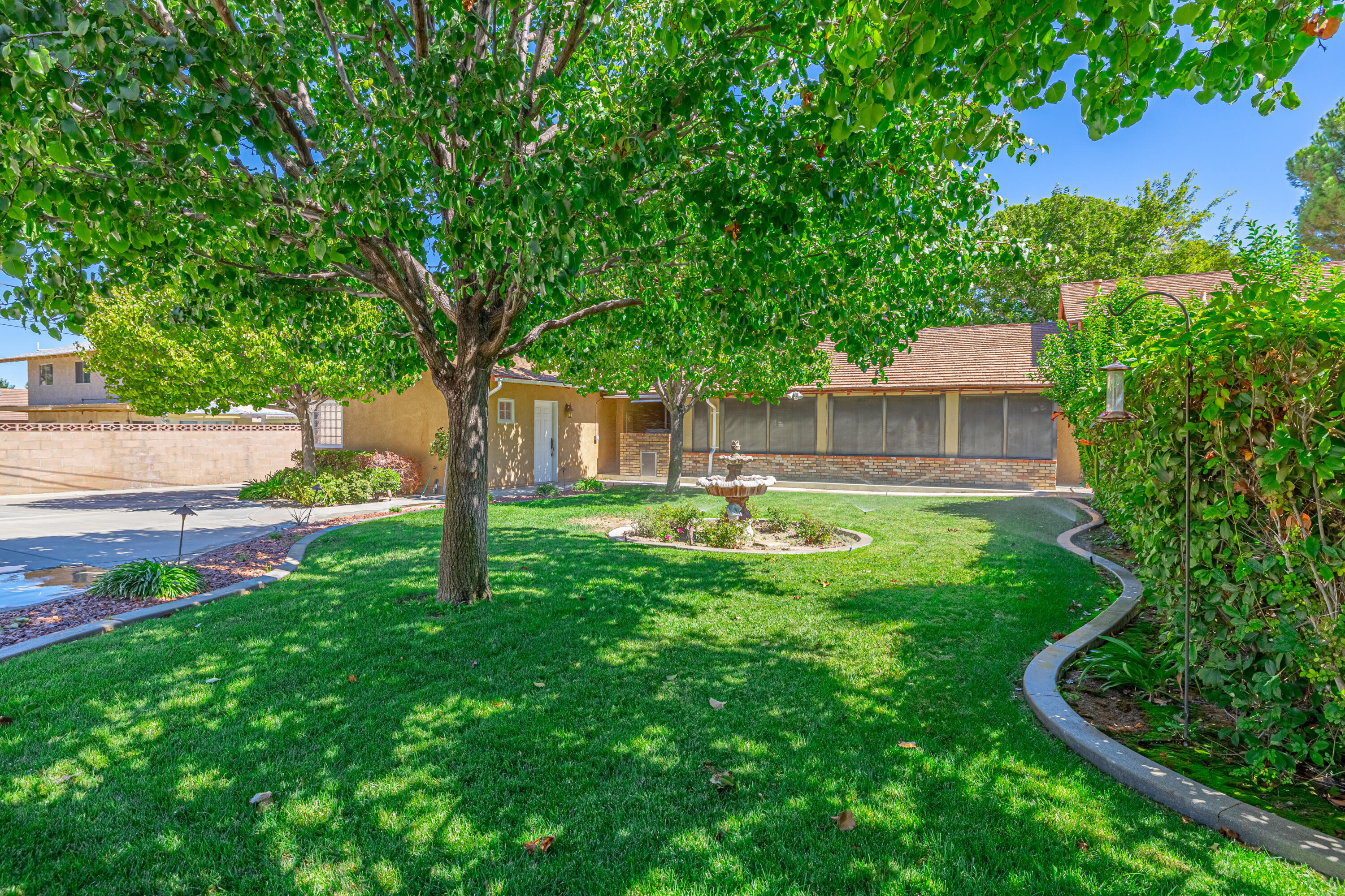 43733 Fenner Avenue Lancaster, CA 93536 - Photo 43 of 48 a front view of a house with yard patio and green space
