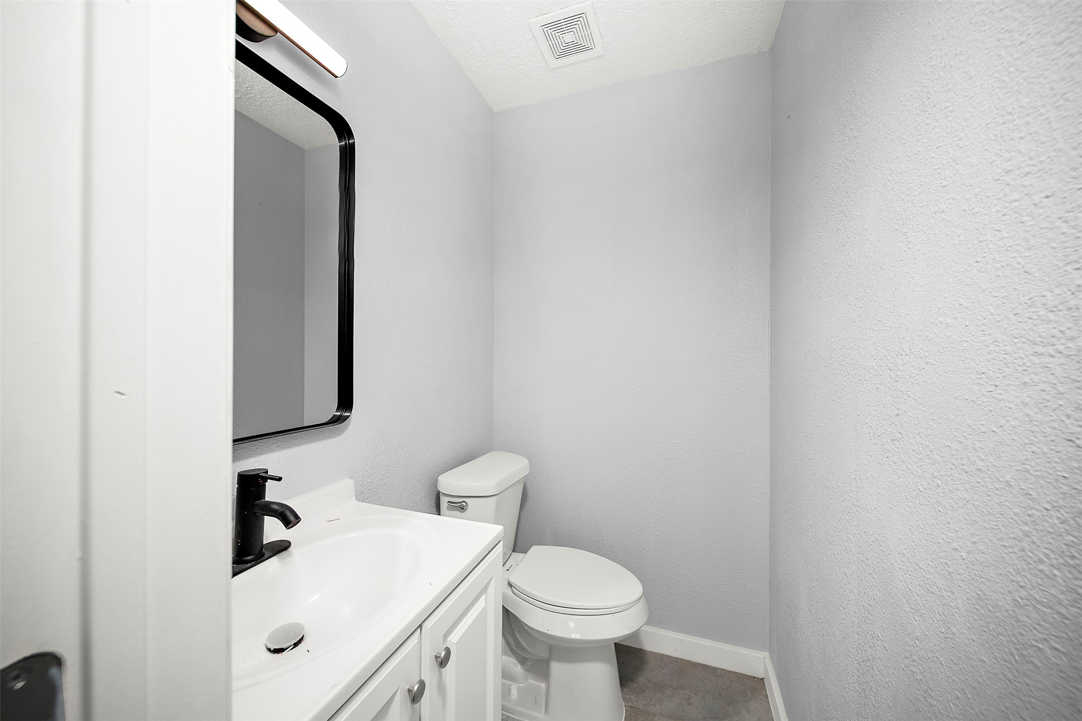 16415 Woodrow Street, Unit 24 Channelview, TX 77530 - Photo 7 of 11 a bathroom with a sink toilet and mirror