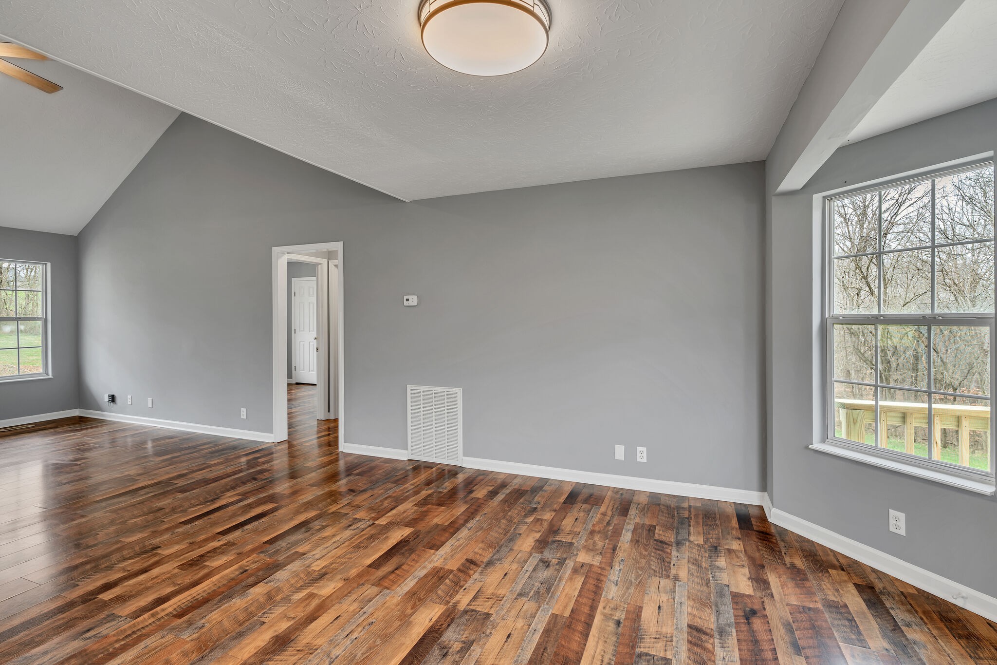3716 Dobbin Road Springfield, TN 37172 - Photo 12 of 34 a view of an empty room with window and wooden floor
