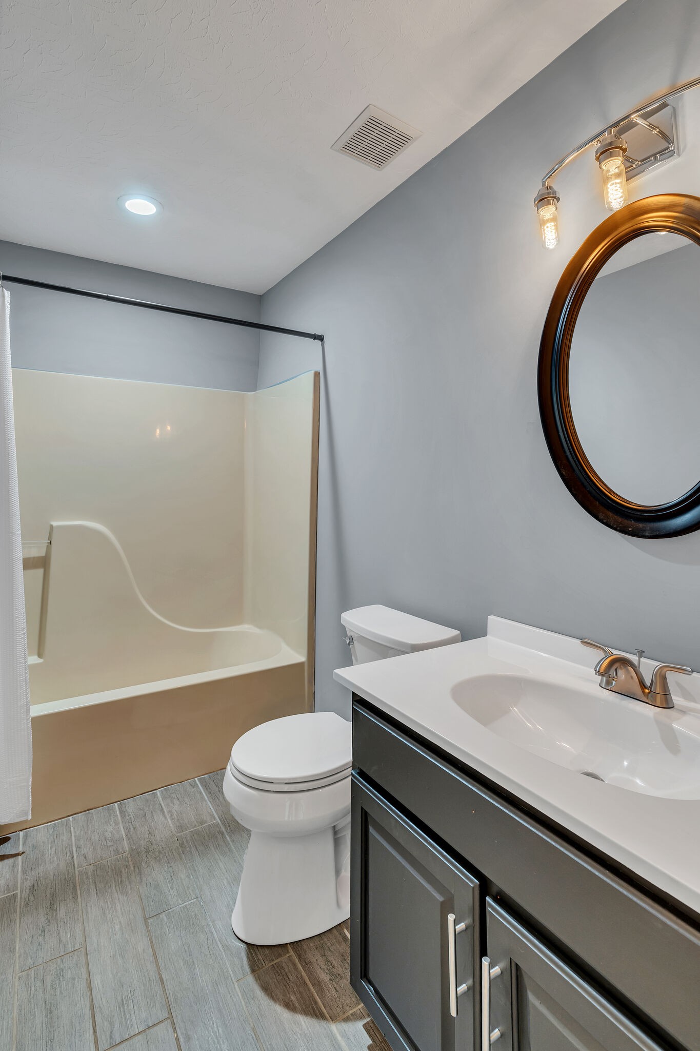 3716 Dobbin Road Springfield, TN 37172 - Photo 23 of 34 a bathroom with a sink a toilet and a mirror