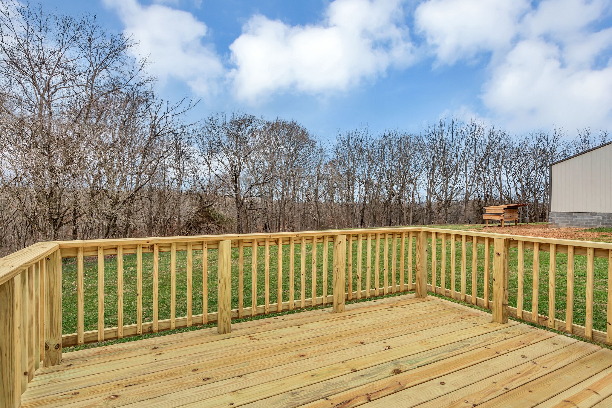 3716 Dobbin Road Springfield, TN 37172 - Photo 26 of 34 a view of deck with large trees and wooden fence