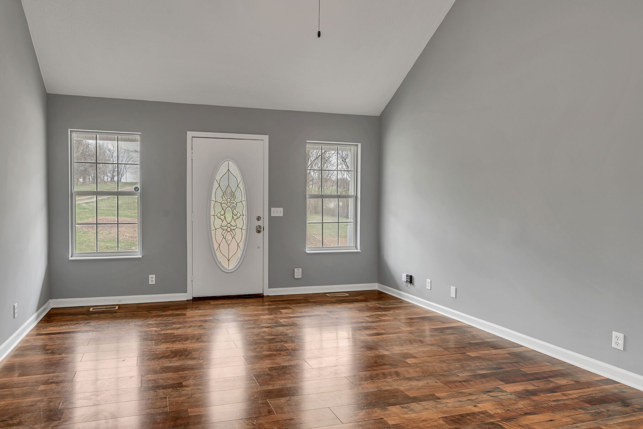 3716 Dobbin Road Springfield, TN 37172 - Photo 10 of 34 an empty room with wooden floor and windows