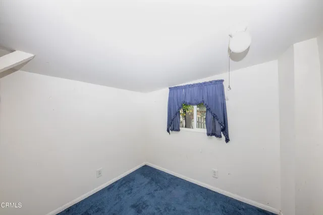 a view of a room with closet and mirror