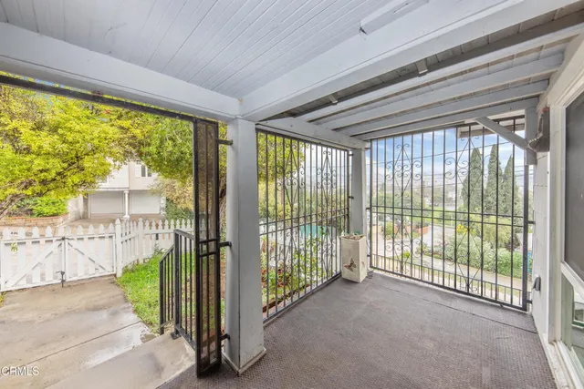 a view of a porch with wooden floor and outdoor space