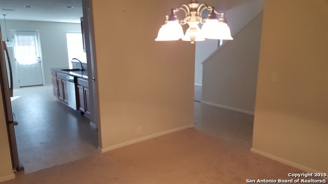 1332 Wagon Wheel Schertz, TX 78154 - Photo 7 of 21 a view of a hallway with wooden floor and a chandelier