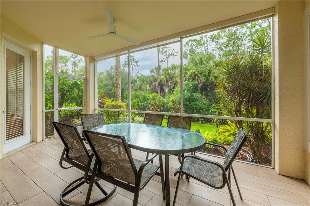 4675 Winged Foot Court, Unit 102 Naples, FL 34114 - Photo 19 of 31 a dining room with furniture and window