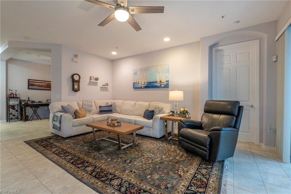 4675 Winged Foot Court, Unit 102 Naples, FL 34114 - Photo 20 of 31 a living room with furniture