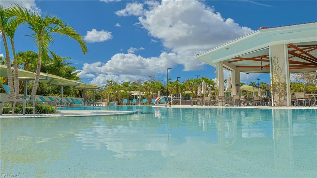 4675 Winged Foot Court, Unit 102 Naples, FL 34114 - Photo 25 of 31 a view of an ocean with building