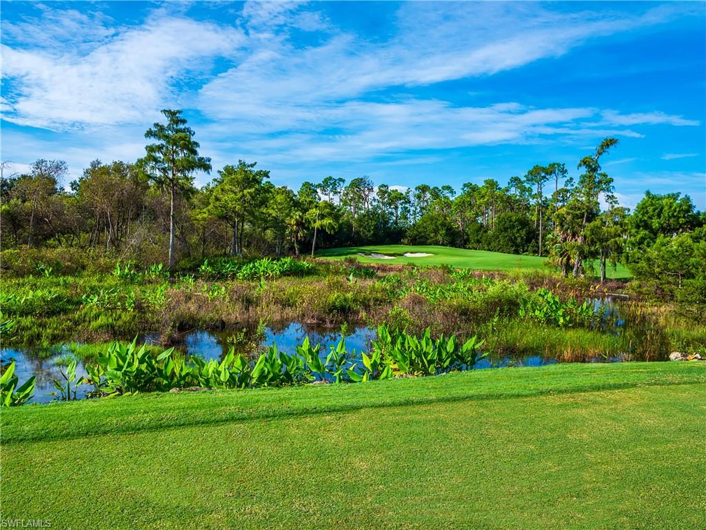 4675 Winged Foot Court, Unit 102 Naples, FL 34114 - Photo 26 of 31 a view of a garden with an outdoor space