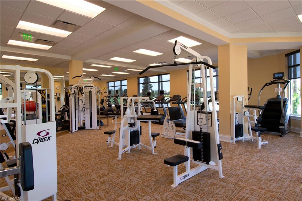 4675 Winged Foot Court, Unit 102 Naples, FL 34114 - Photo 28 of 31 a view of a room with gym equipment
