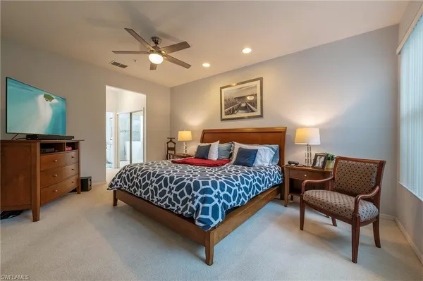 a bedroom with a bed and dresser