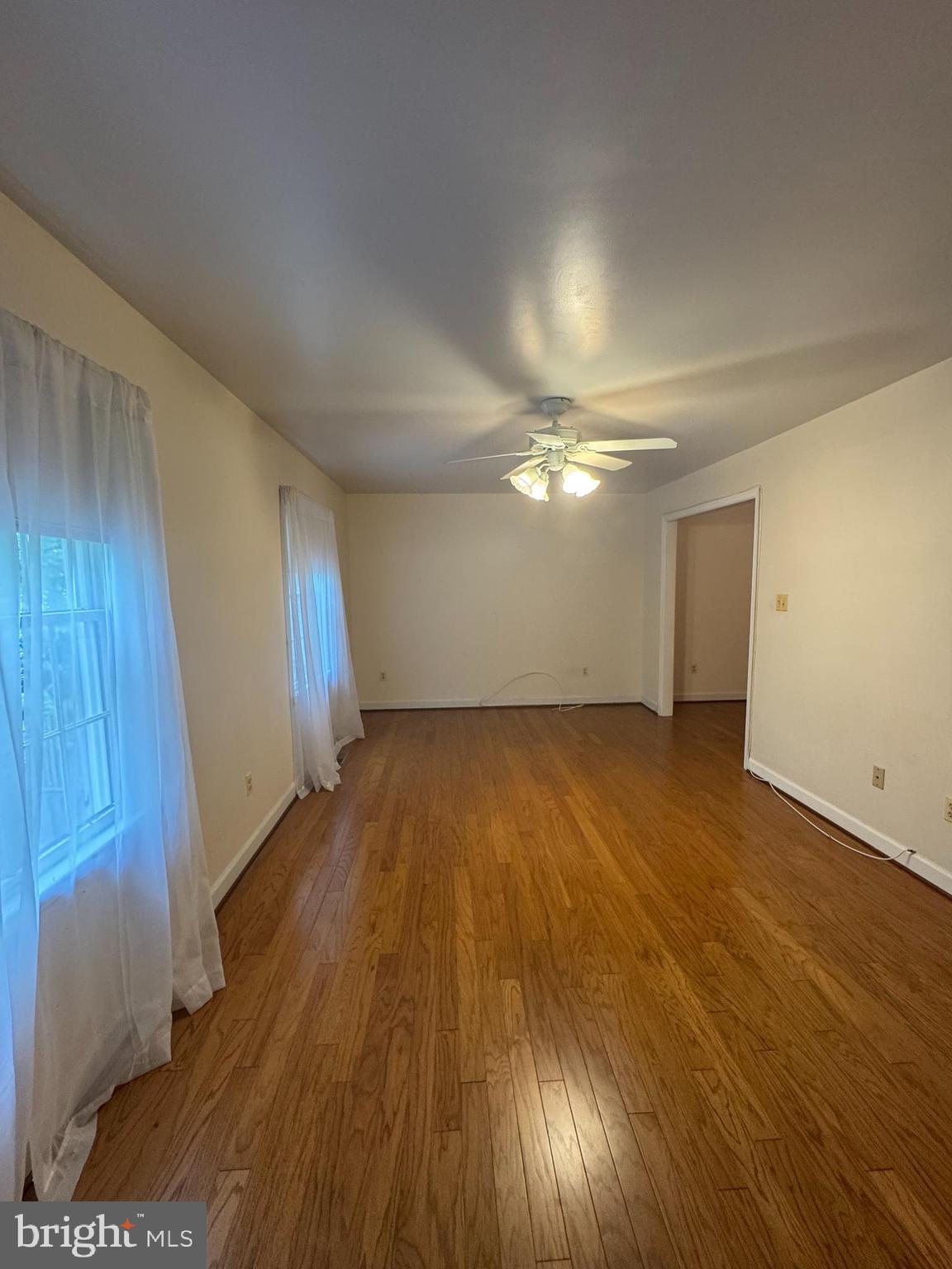 652 Currant Court, Unit 652 La Plata, MD 20646 - Photo 15 of 50 an empty room with wooden floor and windows