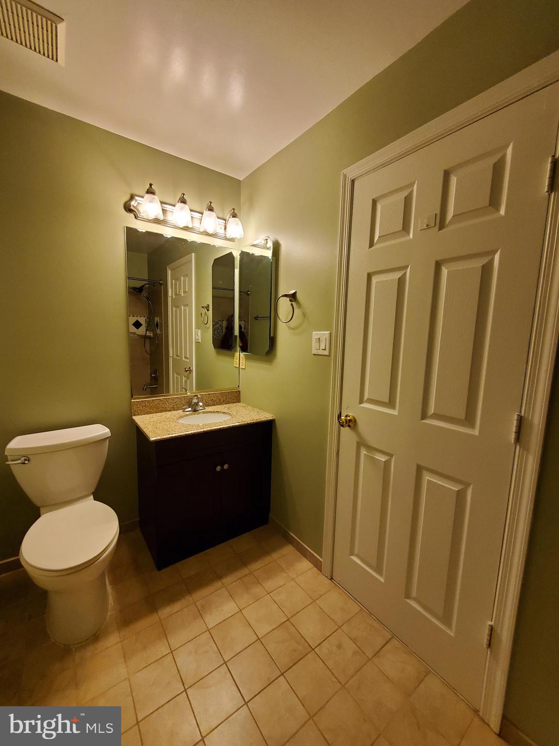 652 Currant Court, Unit 652 La Plata, MD 20646 - Photo 25 of 50 a bathroom with a sink a toilet and mirror