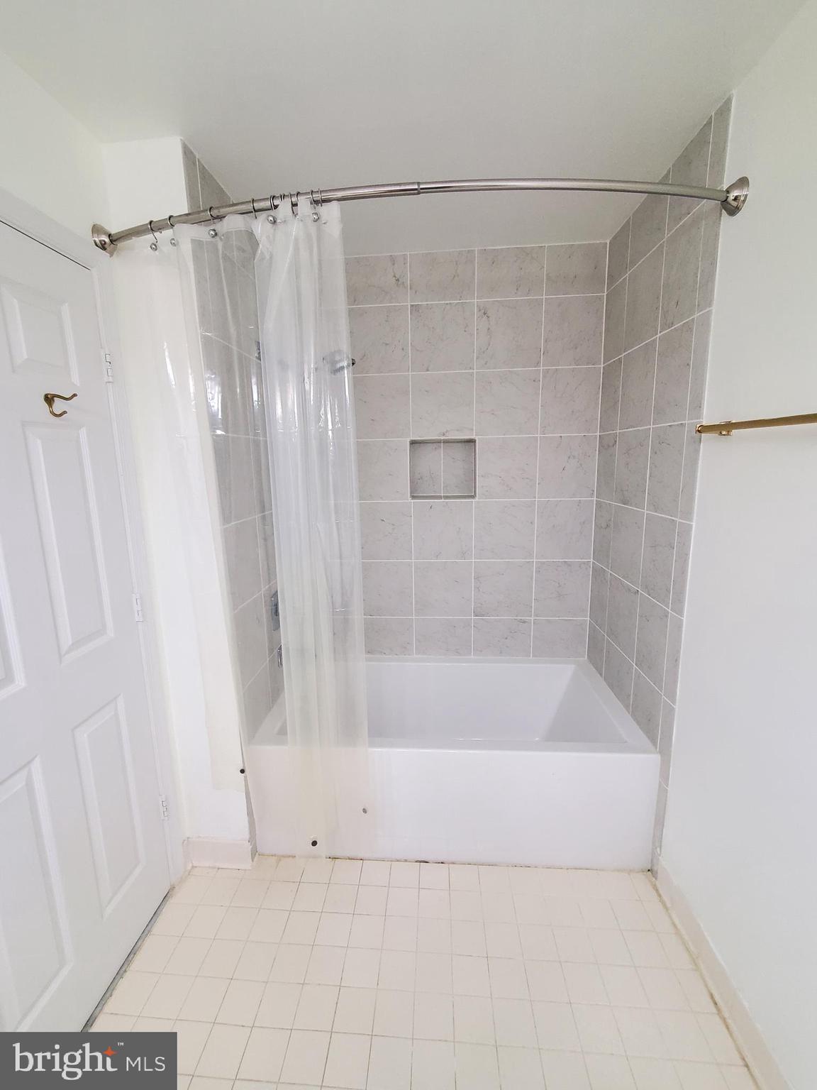 652 Currant Court, Unit 652 La Plata, MD 20646 - Photo 27 of 50 a bathroom with a shower and a tub