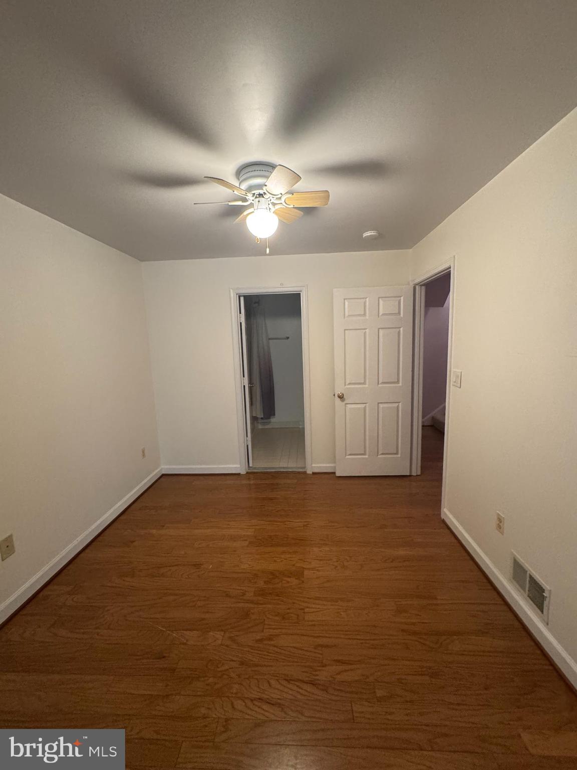 652 Currant Court, Unit 652 La Plata, MD 20646 - Photo 29 of 50 a view of empty room with wooden floor and fan
