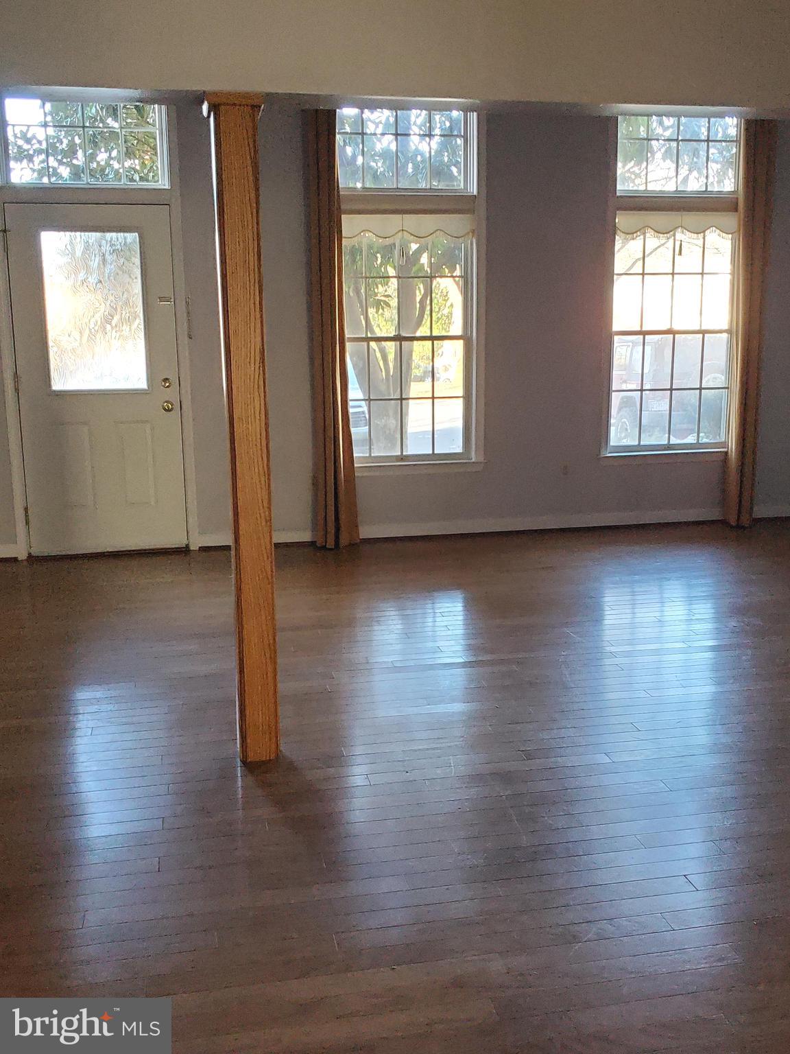 652 Currant Court, Unit 652 La Plata, MD 20646 - Photo 3 of 50 an empty room with wooden floor and windows