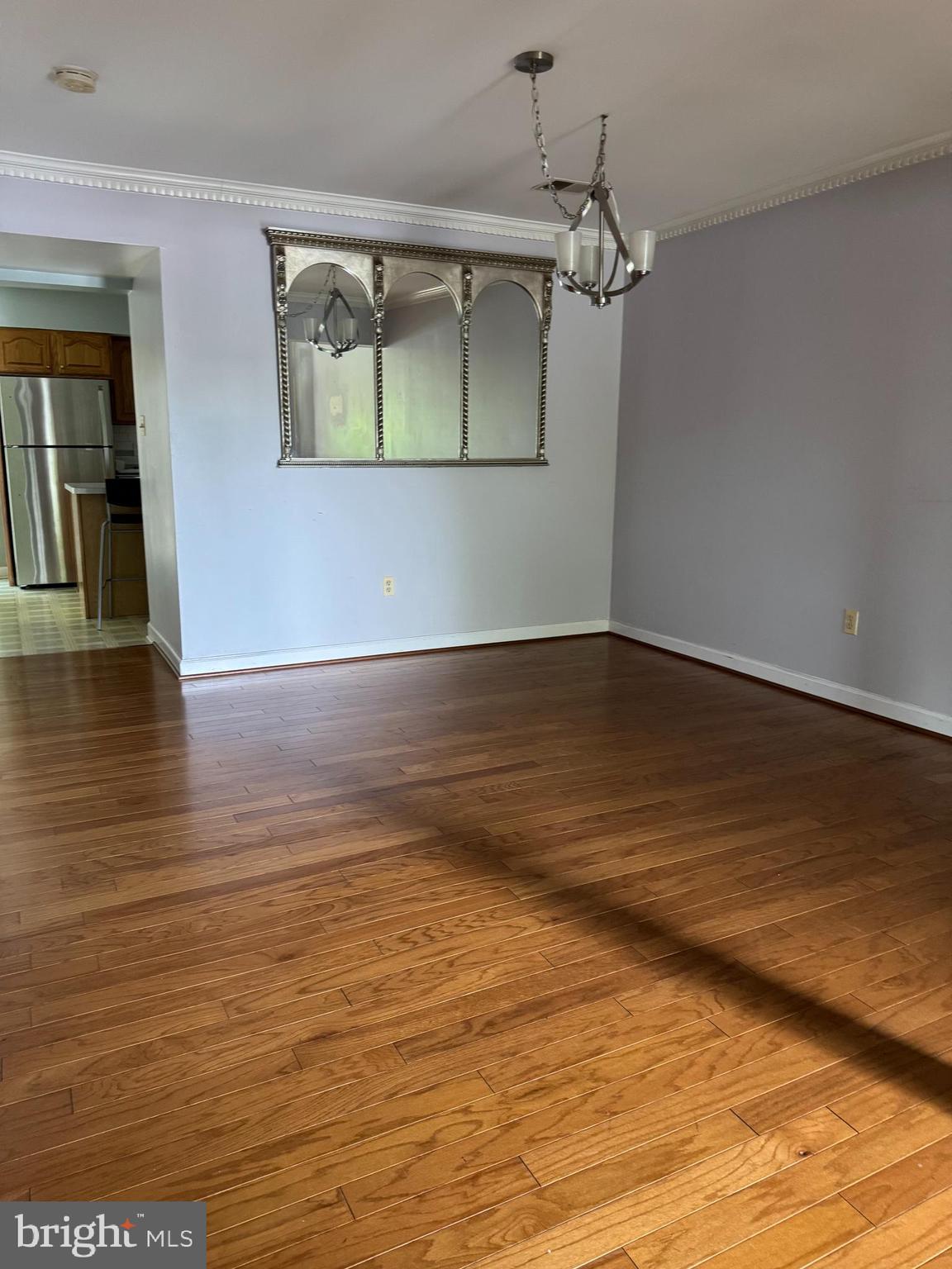 652 Currant Court, Unit 652 La Plata, MD 20646 - Photo 36 of 50 a view of an empty room with wooden floor and a window