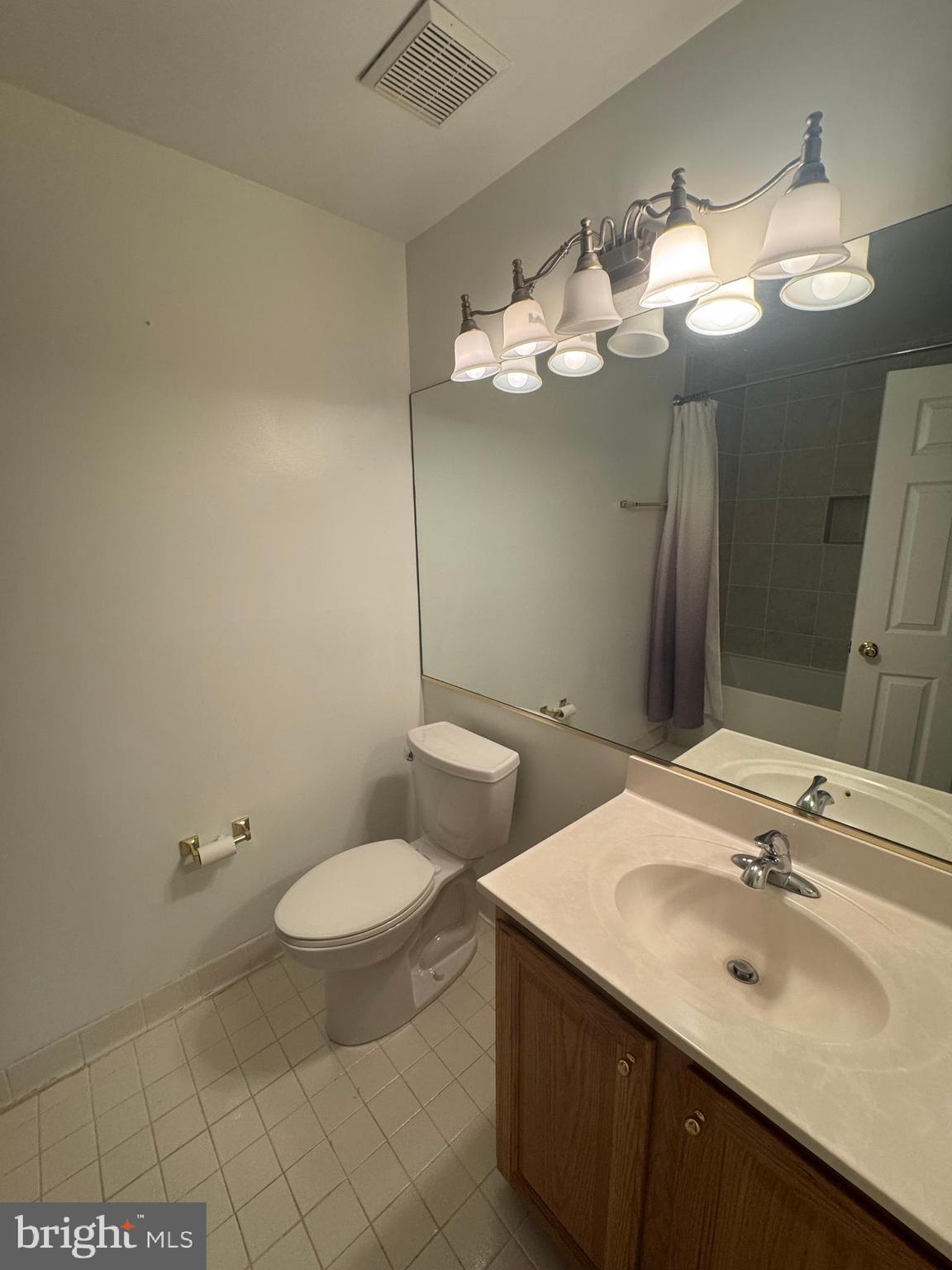 652 Currant Court, Unit 652 La Plata, MD 20646 - Photo 40 of 50 a bathroom with a toilet sink and mirror