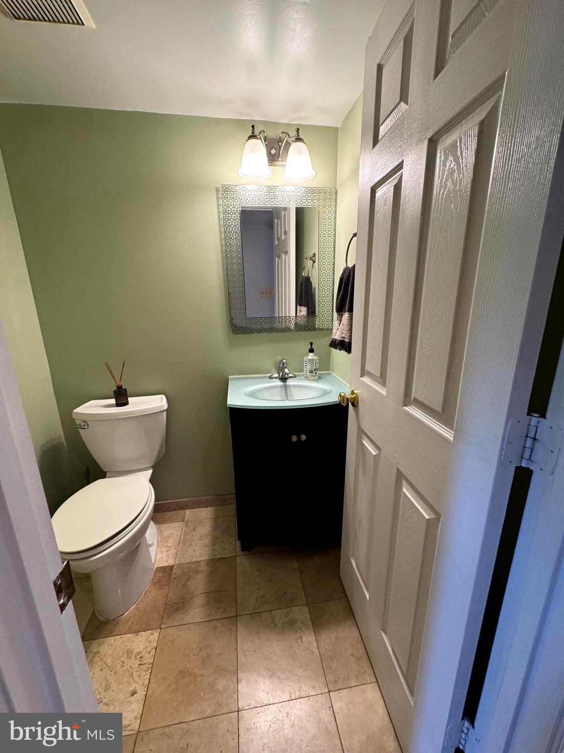 652 Currant Court, Unit 652 La Plata, MD 20646 - Photo 45 of 50 a bathroom with a sink a toilet and mirror