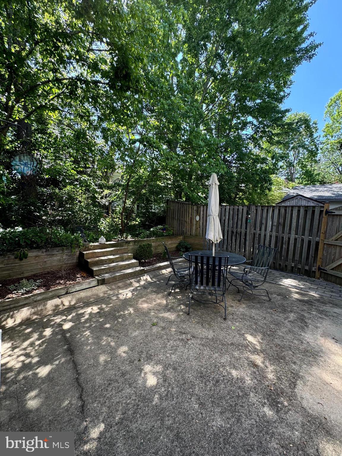 652 Currant Court, Unit 652 La Plata, MD 20646 - Photo 47 of 50 a view of backyard with table and chairs and a large tree