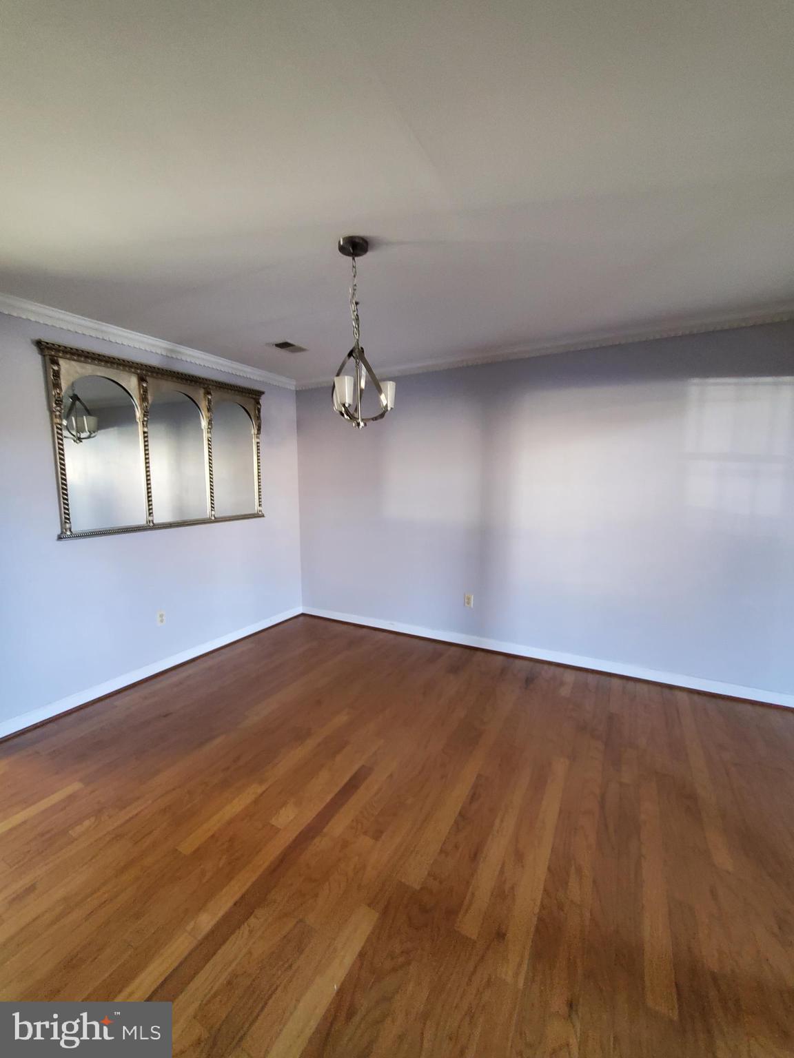 652 Currant Court, Unit 652 La Plata, MD 20646 - Photo 8 of 50 an empty room with wooden floor and windows