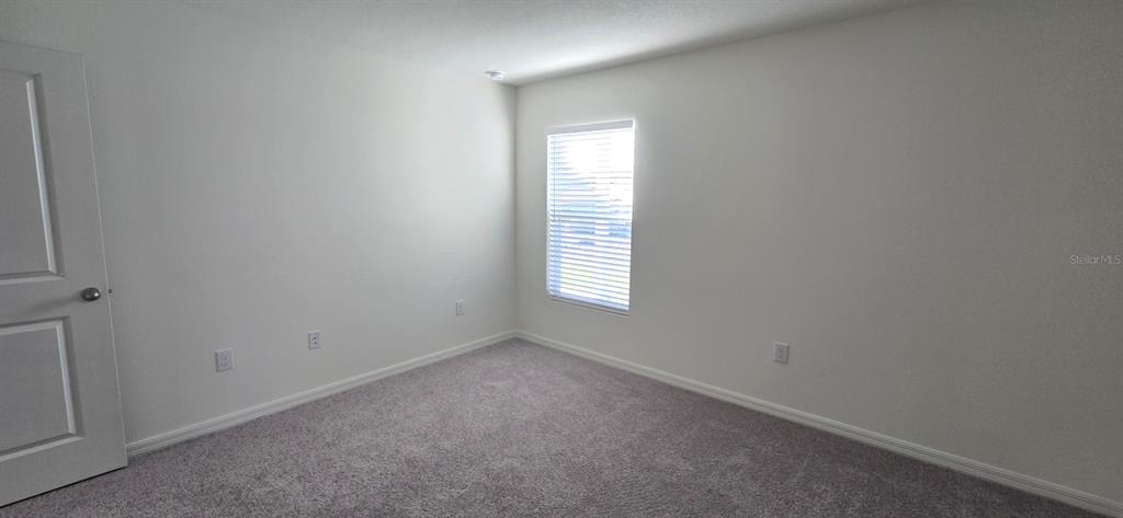 6010 Southwest 128th St Road Ocala, FL 34473 - Photo 5 of 16 an empty room with a window