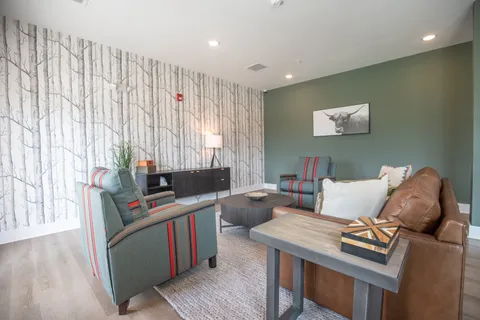 a living room with furniture and a table