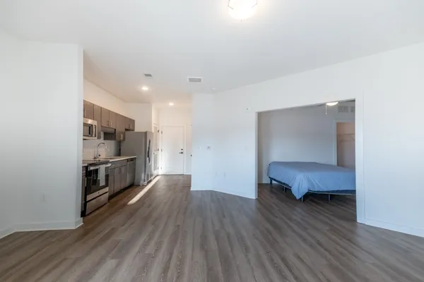 a kitchen with stainless steel appliances a refrigerator and a stove top oven