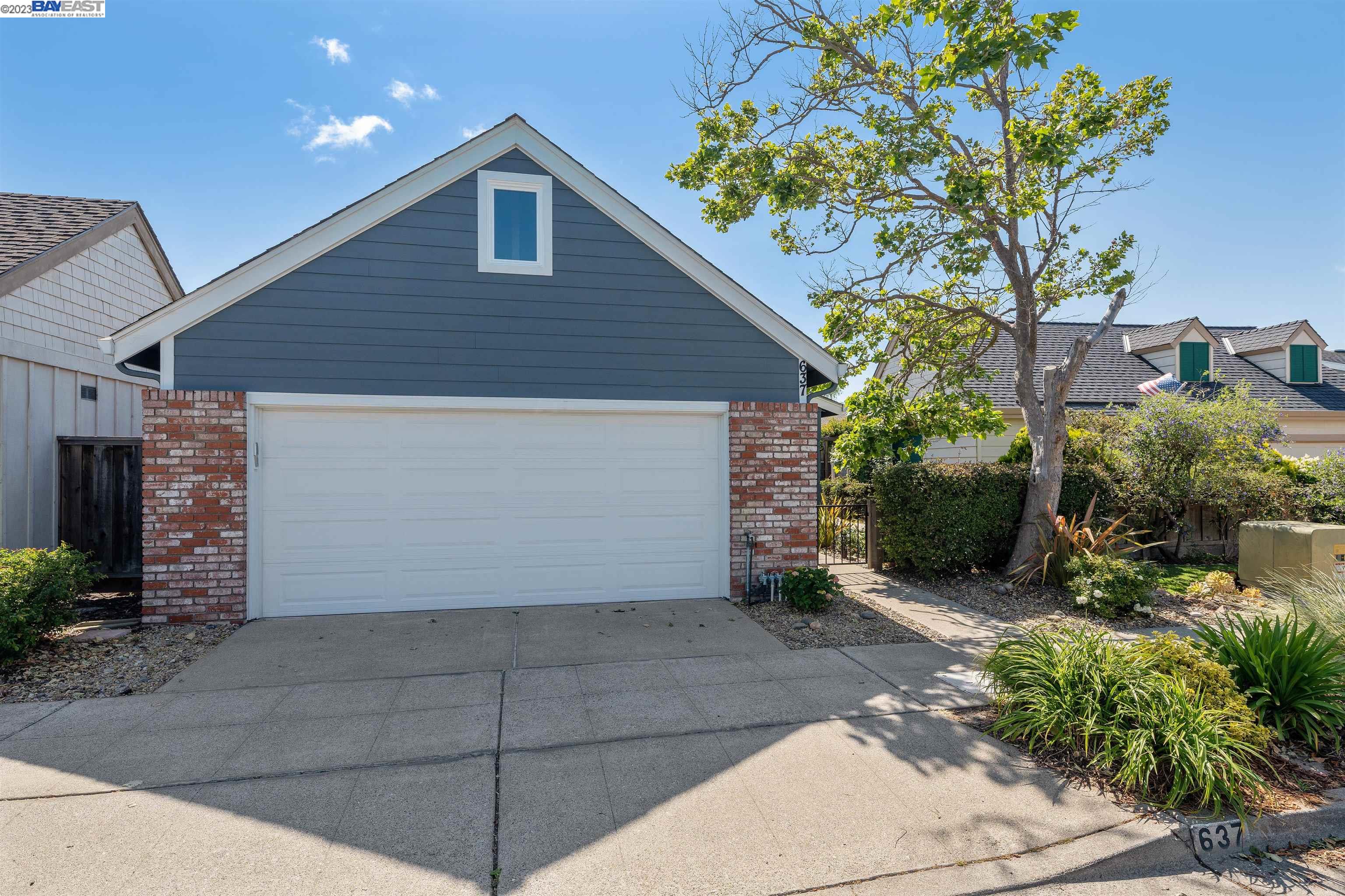 Undisclosed Address Alameda, CA 94502 - Photo 1 of 44 a front view of a house with garden