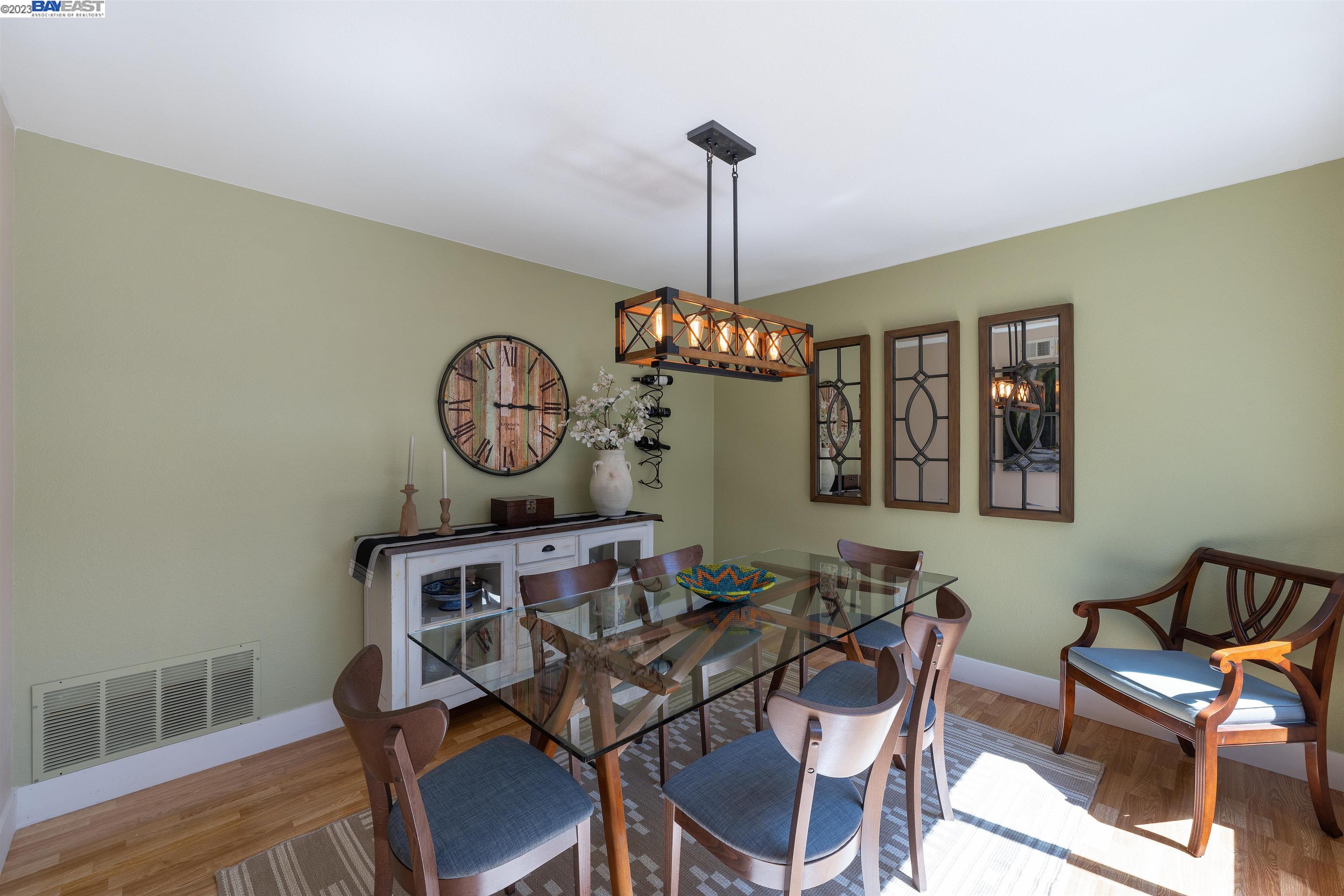 Undisclosed Address Alameda, CA 94502 - Photo 12 of 44 a view of a dining room with furniture a chandelier and wooden floor