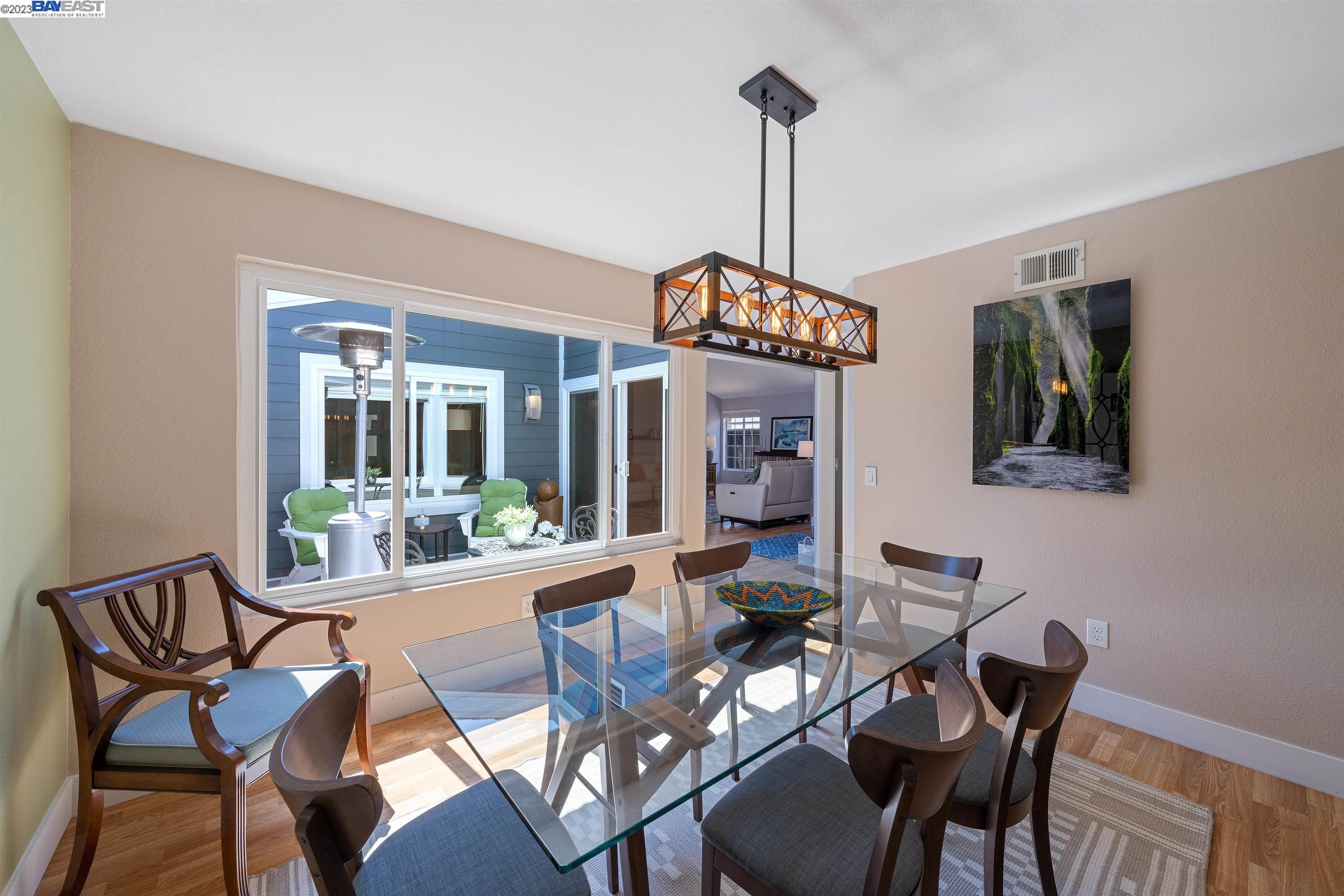 Undisclosed Address Alameda, CA 94502 - Photo 14 of 44 a view of a dining room with furniture window and wooden floor