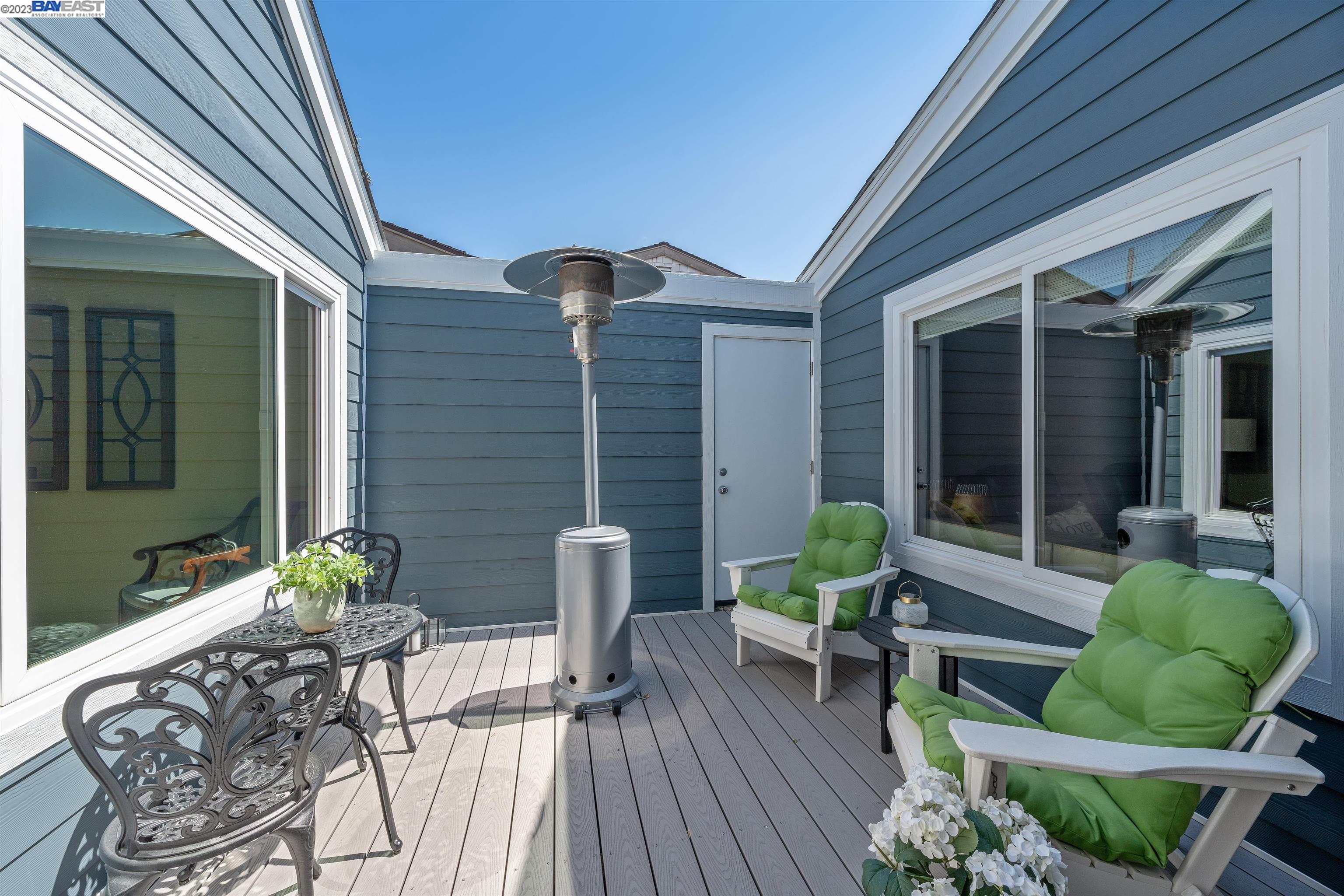 Undisclosed Address Alameda, CA 94502 - Photo 15 of 44 a view of a chair and tables in patio of the house