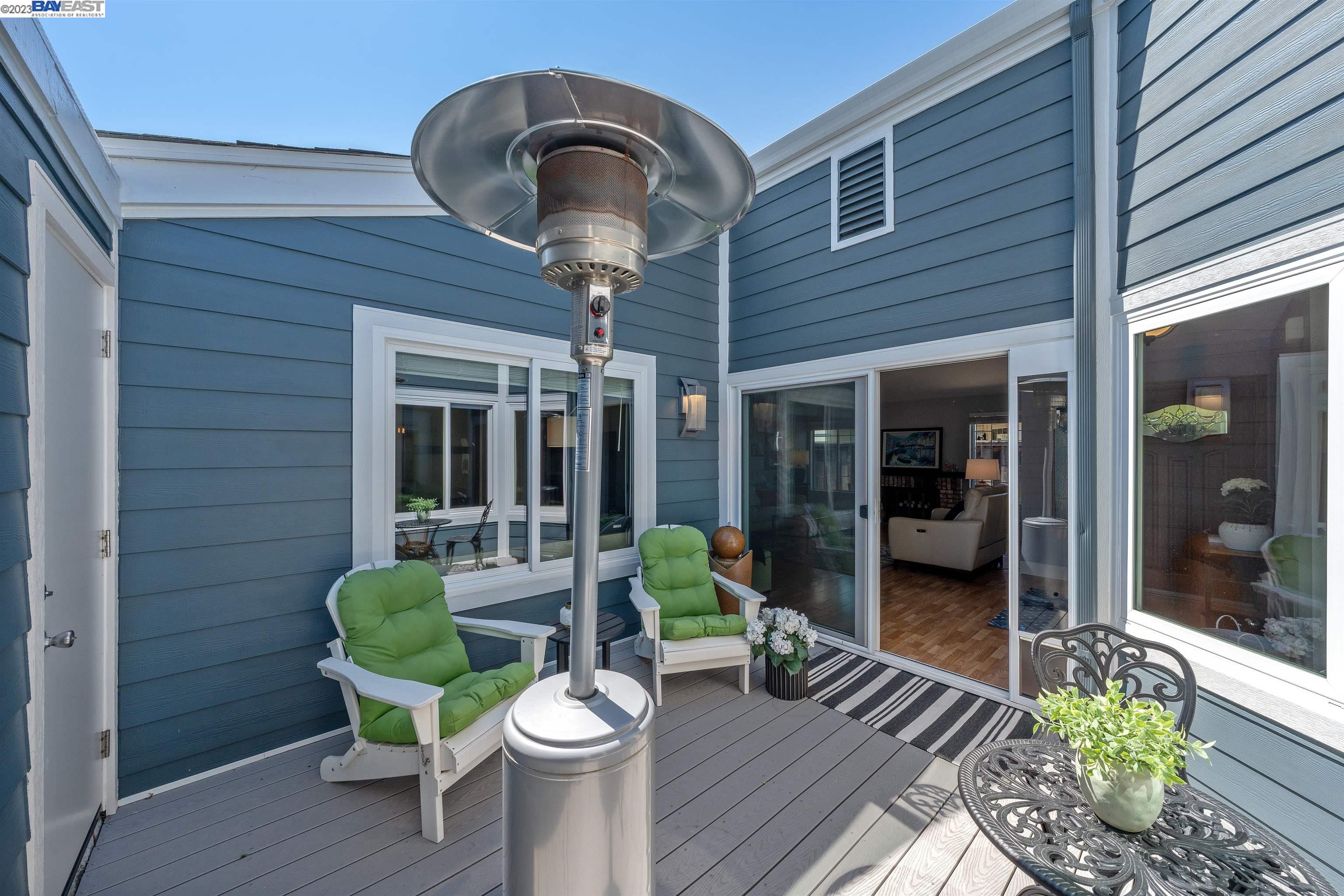 Undisclosed Address Alameda, CA 94502 - Photo 17 of 44 a view of a chair and tables in the patio and a fire pit