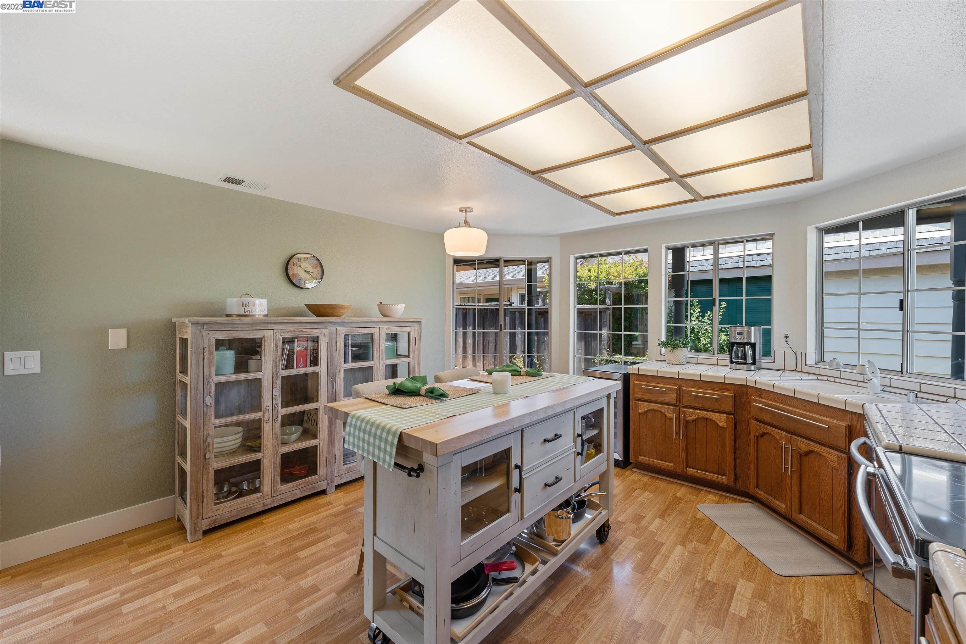 Undisclosed Address Alameda, CA 94502 - Photo 20 of 44 a kitchen with stainless steel appliances granite countertop a stove and cabinets