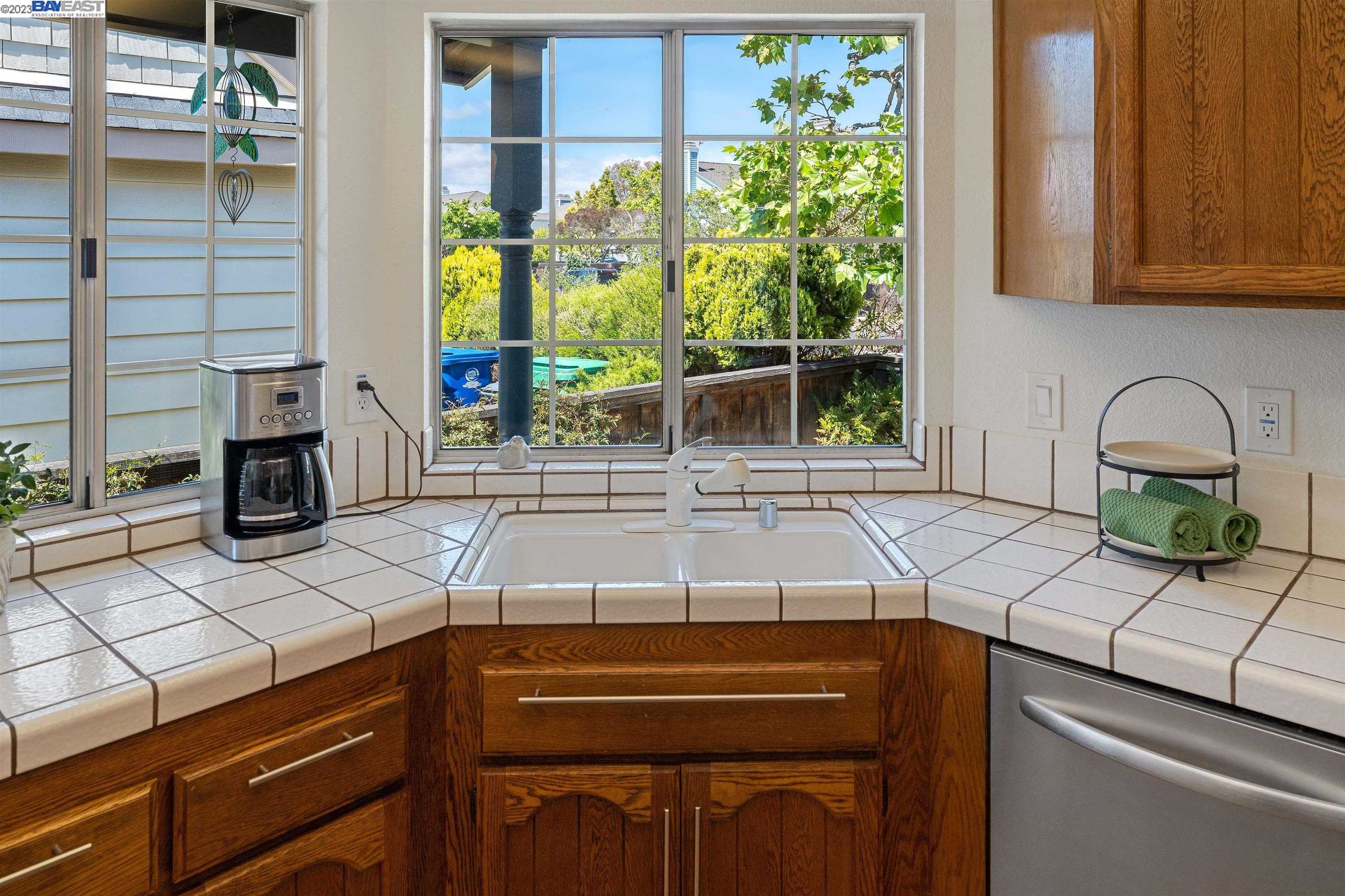 Undisclosed Address Alameda, CA 94502 - Photo 23 of 44 a kitchen with a sink and a stove next to a window