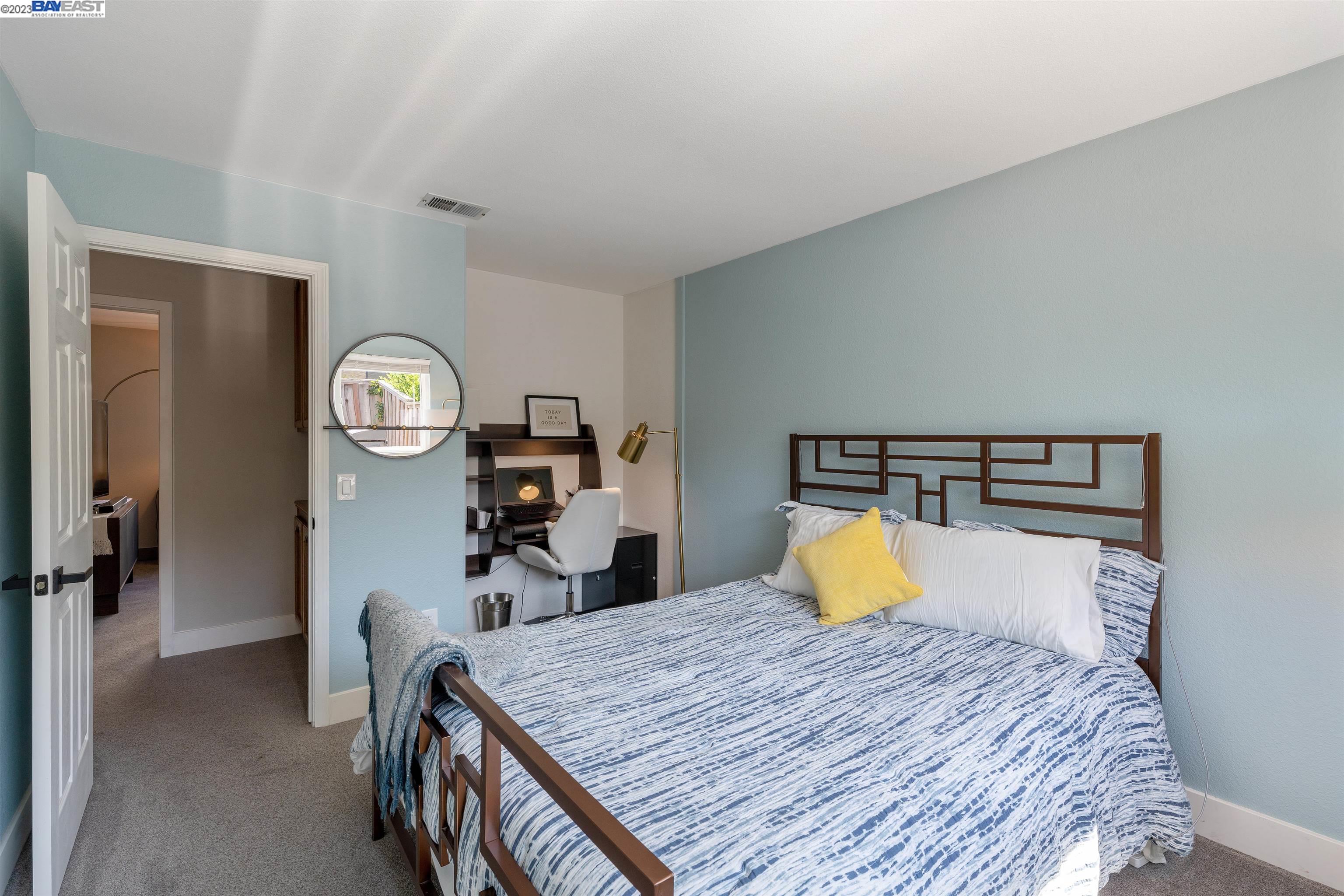 Undisclosed Address Alameda, CA 94502 - Photo 26 of 44 a bedroom with a bed and mirror