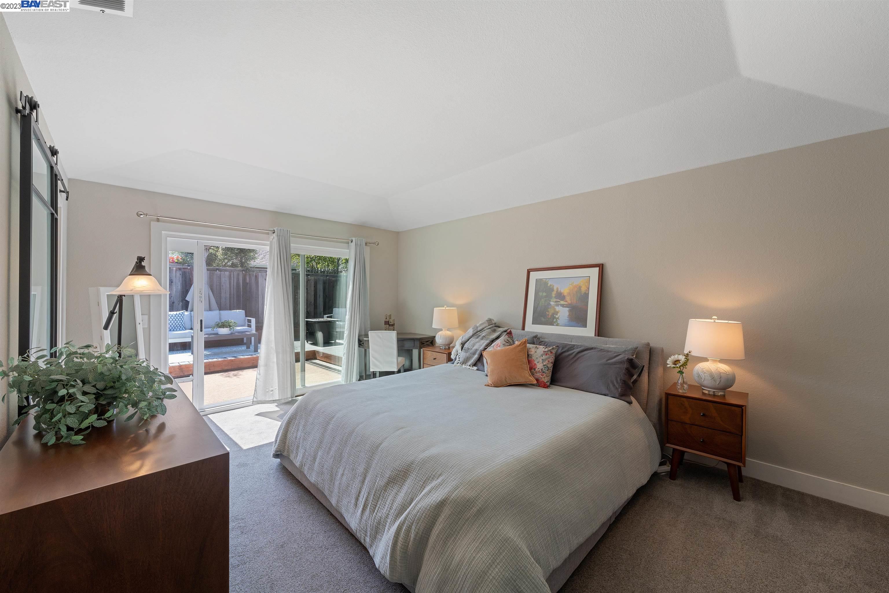 Undisclosed Address Alameda, CA 94502 - Photo 29 of 44 a bedroom with a large bed and a potted plant