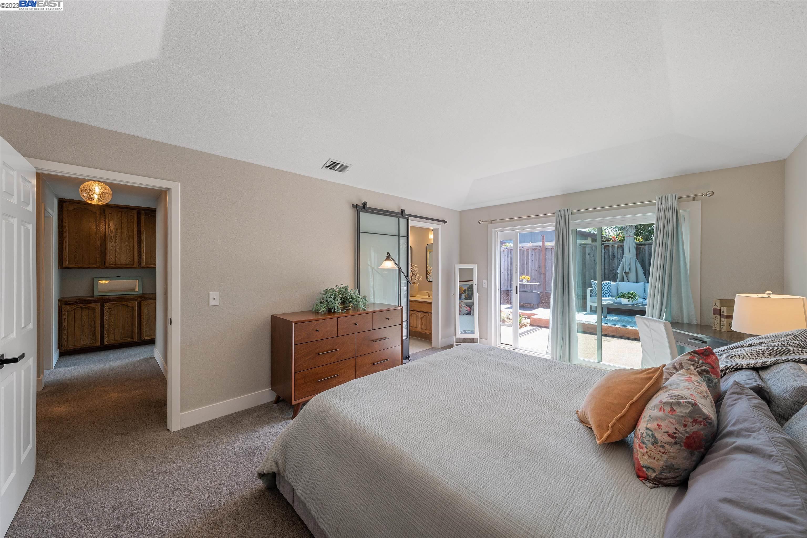 Undisclosed Address Alameda, CA 94502 - Photo 30 of 44 a bedroom with a large bed and furniture