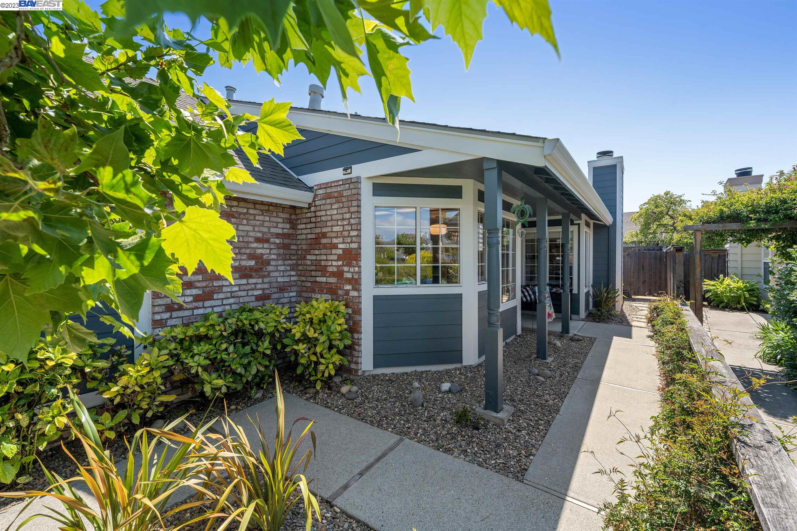 Undisclosed Address Alameda, CA 94502 - Photo 3 of 44 a front view of a house with a yard