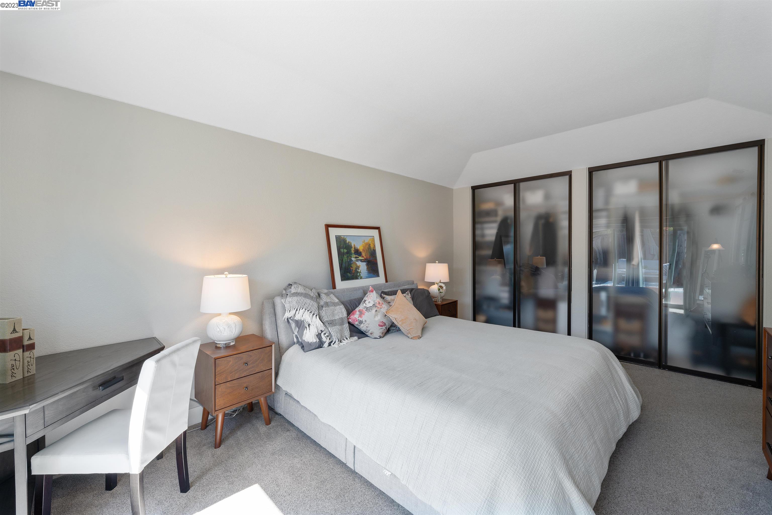 Undisclosed Address Alameda, CA 94502 - Photo 31 of 44 a bedroom with a bed and a lamp