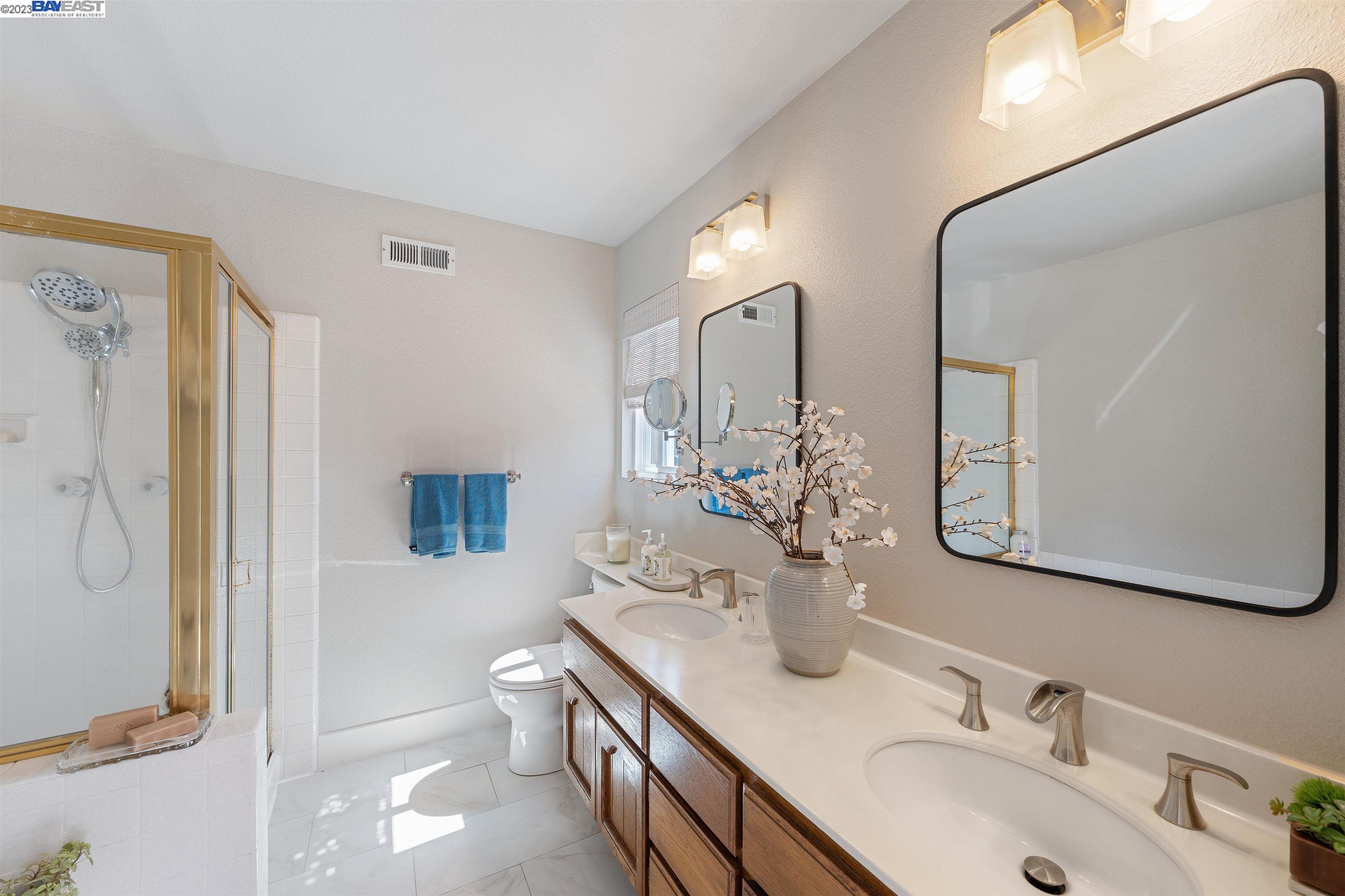 Undisclosed Address Alameda, CA 94502 - Photo 34 of 44 a bathroom with a double vanity sink mirror and toilet