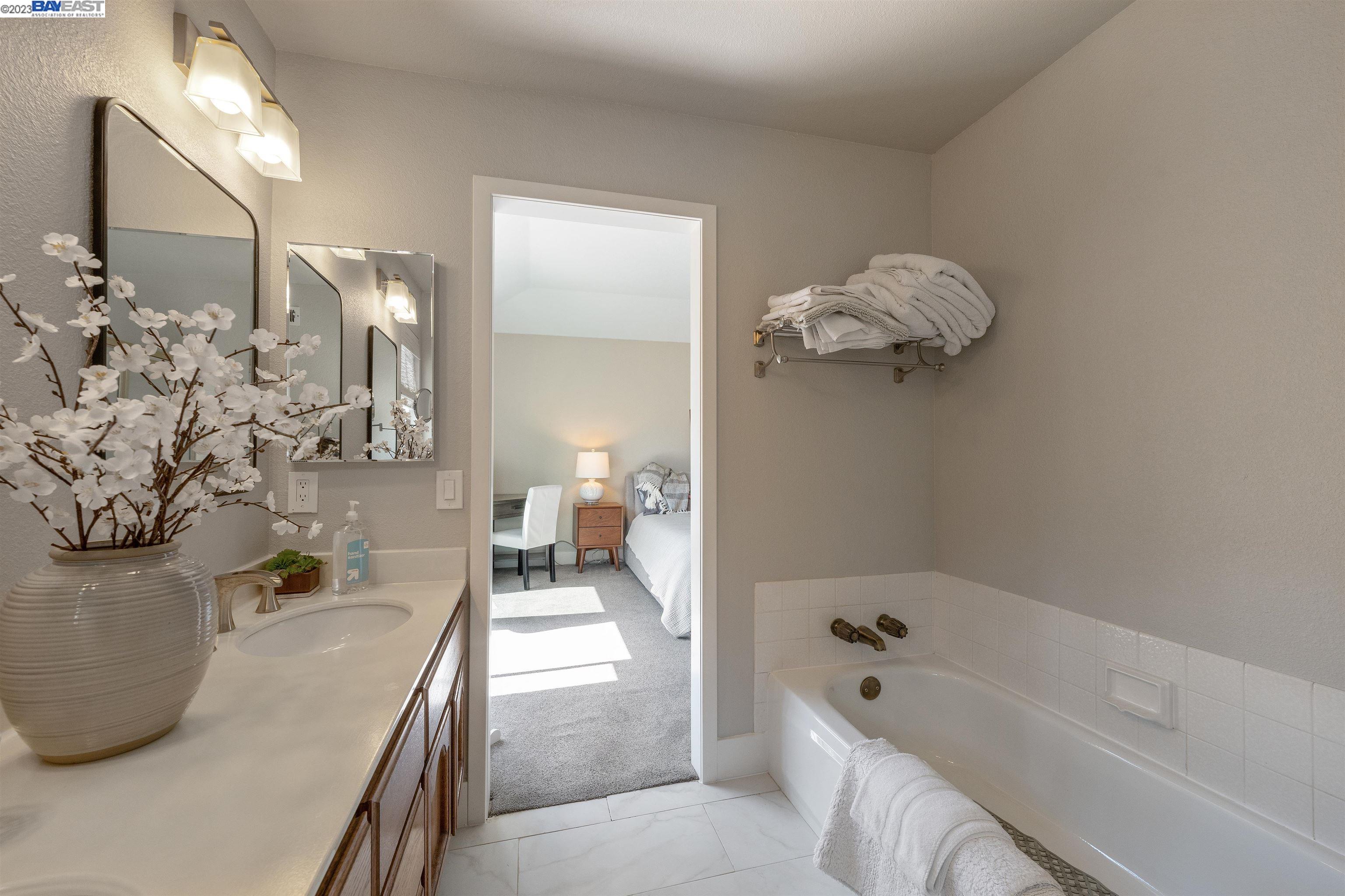 Undisclosed Address Alameda, CA 94502 - Photo 36 of 44 a bathroom with a tub sink and mirror