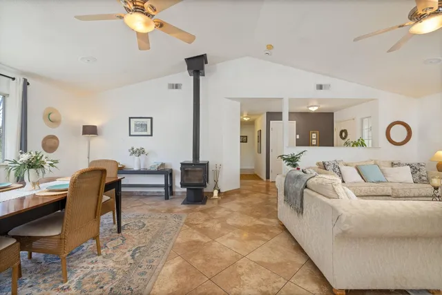 a bathroom with a shower curtain and a window